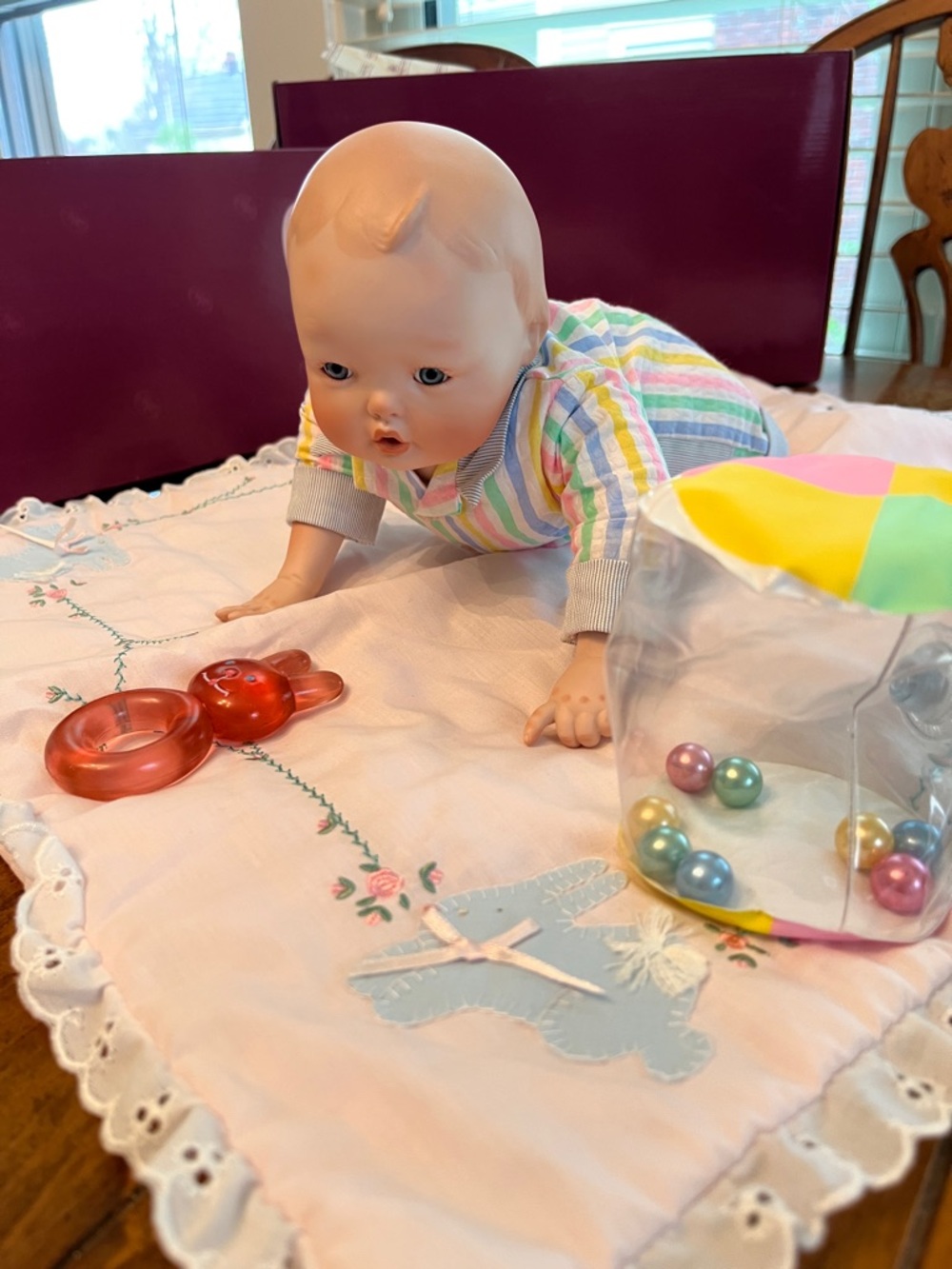 Classic Porcelain Baby Doll in Pastel Striped Outfit